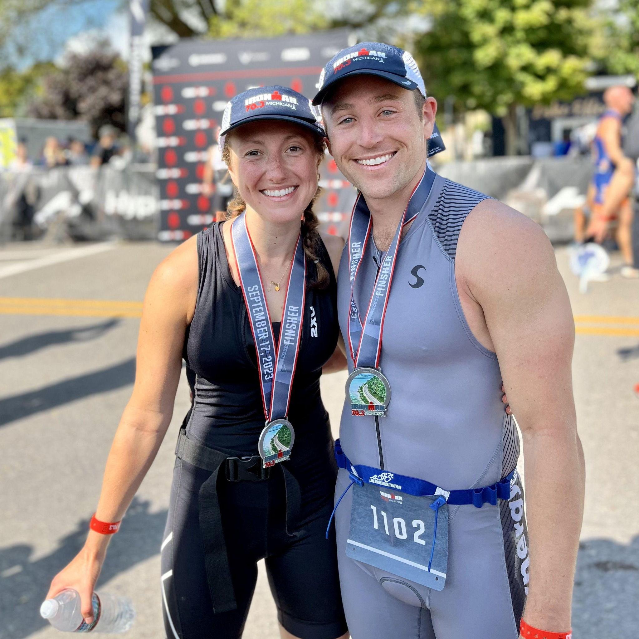 First half Ironman together! Smiling through the pain and armpit chafing