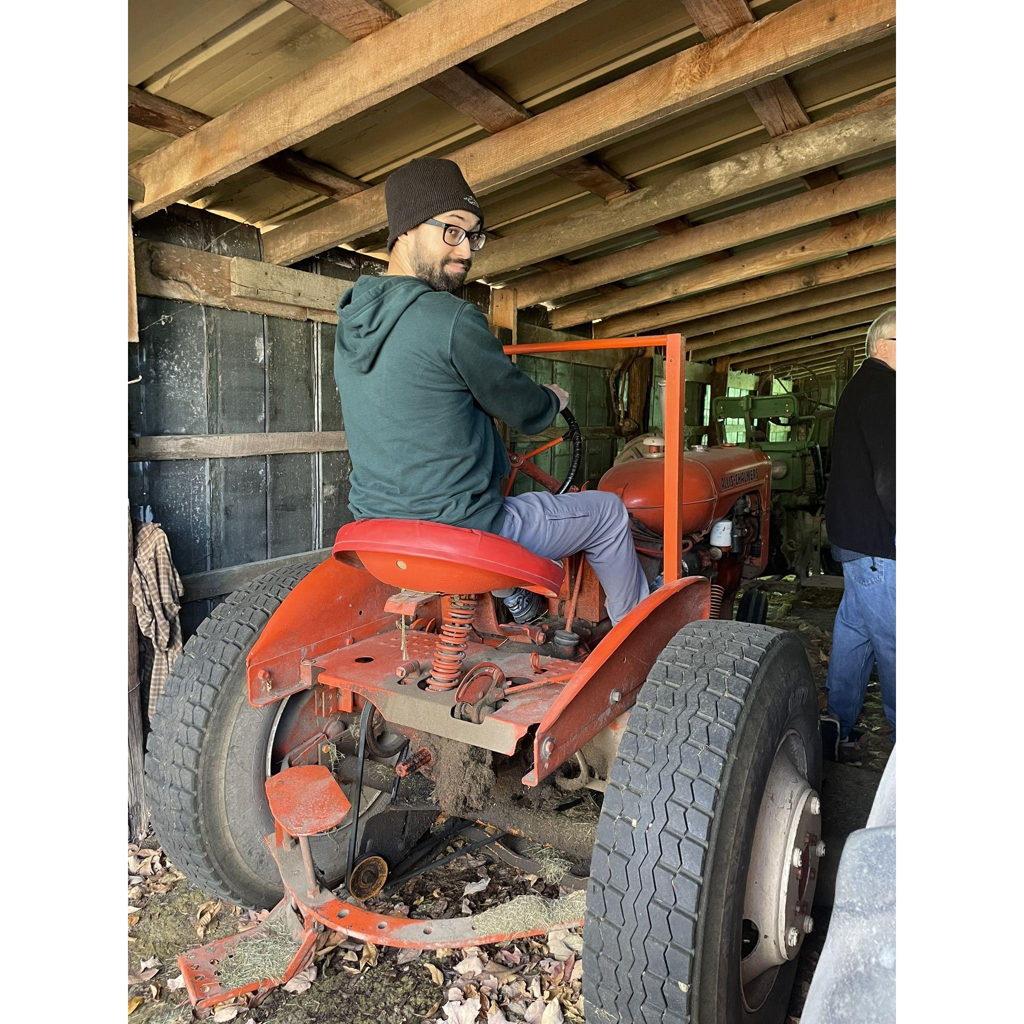 Omar on my grandfather's tractor. He was very excited.