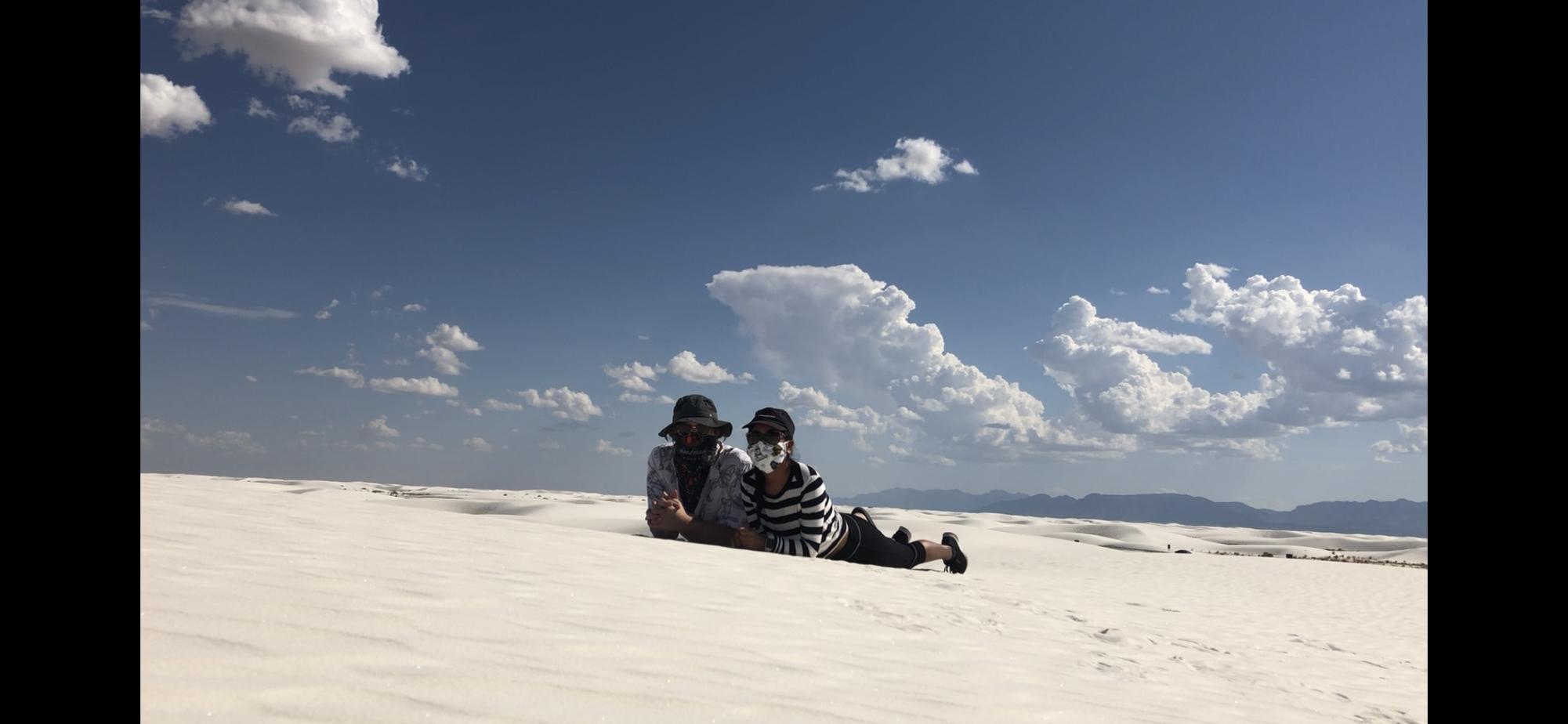 Trying to avoid the wind at White Sands National Park