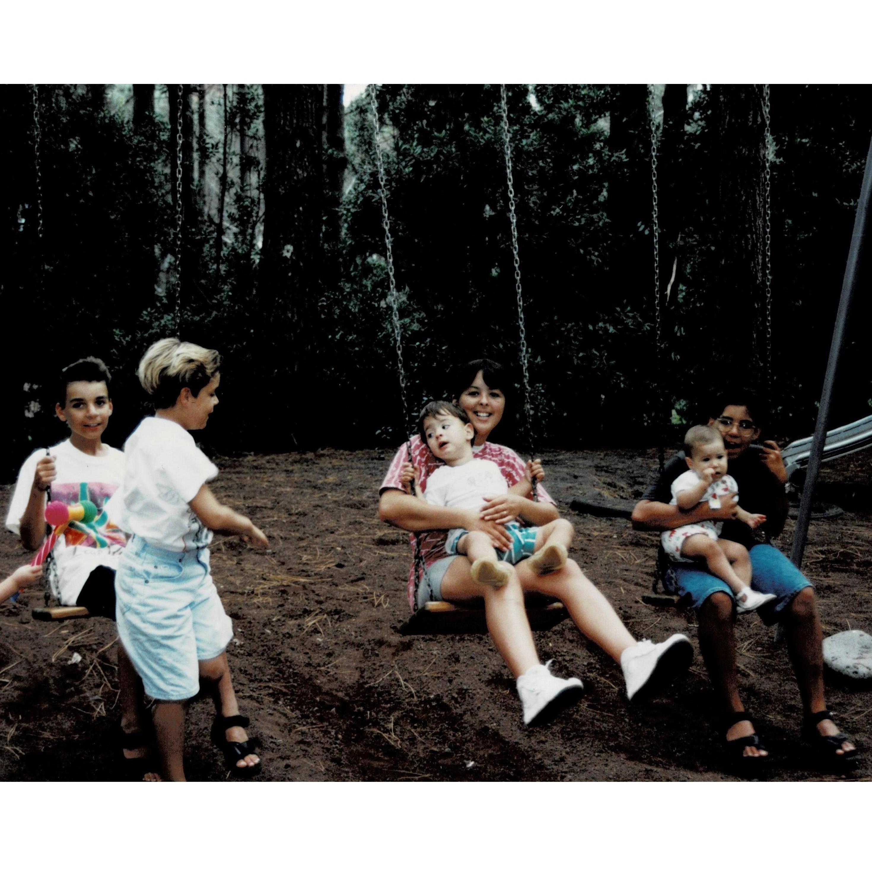 At a park walking distance from Marina's grandmother's house on Pico Island. Marina is a baby surrounded by her cousins and aunt.