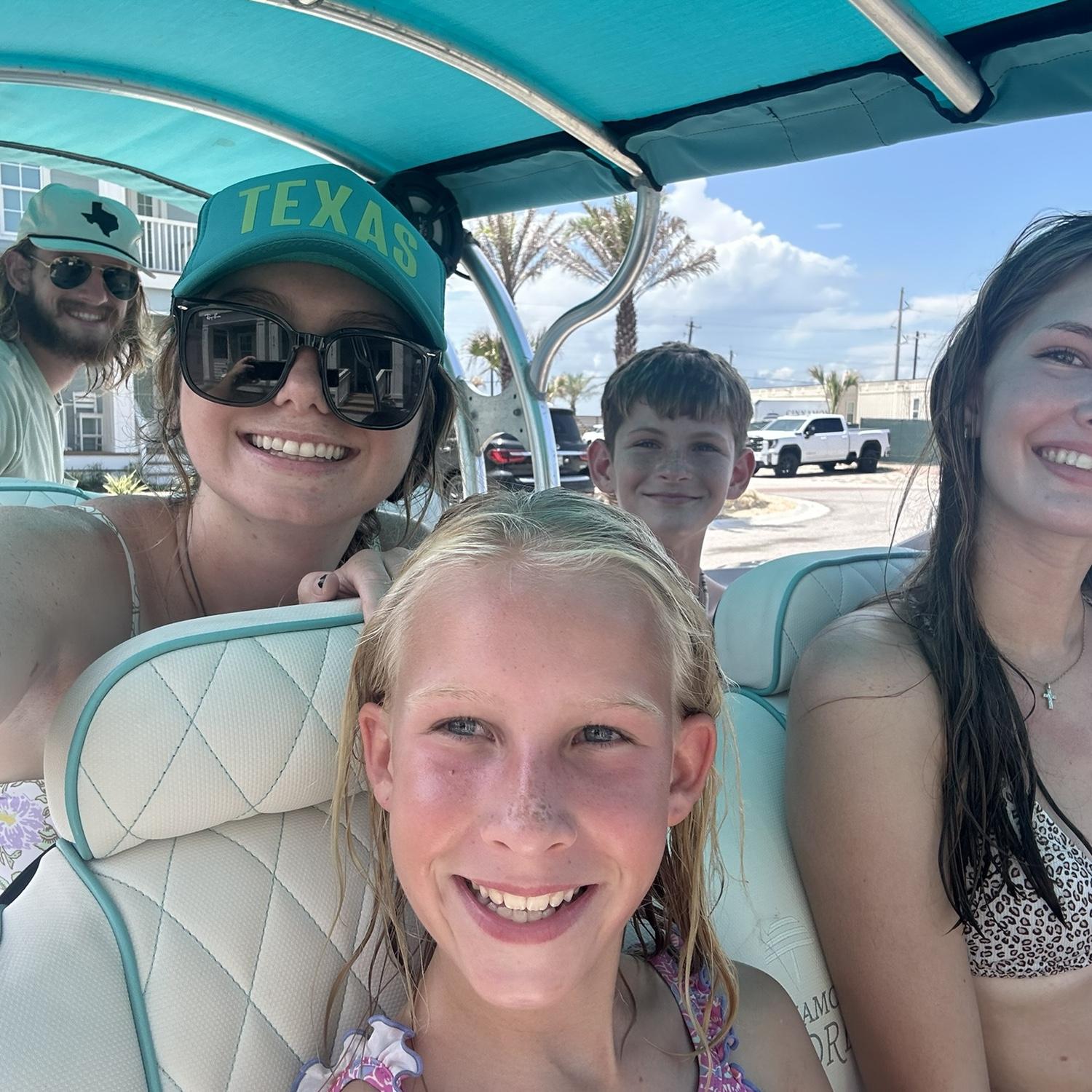 Port Aransas vacation selfie with bridesmaid, Addie, groomsman, Jake, and cousin, Harper - 07.20.24
