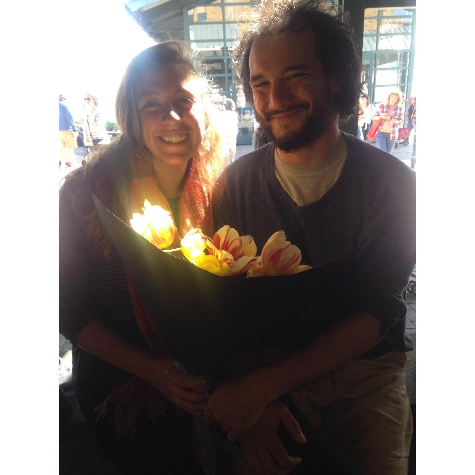 May 2019: One of our more memorable photos. At the City Market, Joseph bought Cassie flowers for the first time and a passerby basically solicited this photo because the "lighting was SO good"