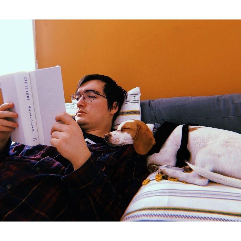John reading with Bagel sleeping