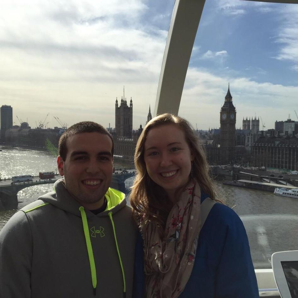 At the London Eye with Big Ben in the background.