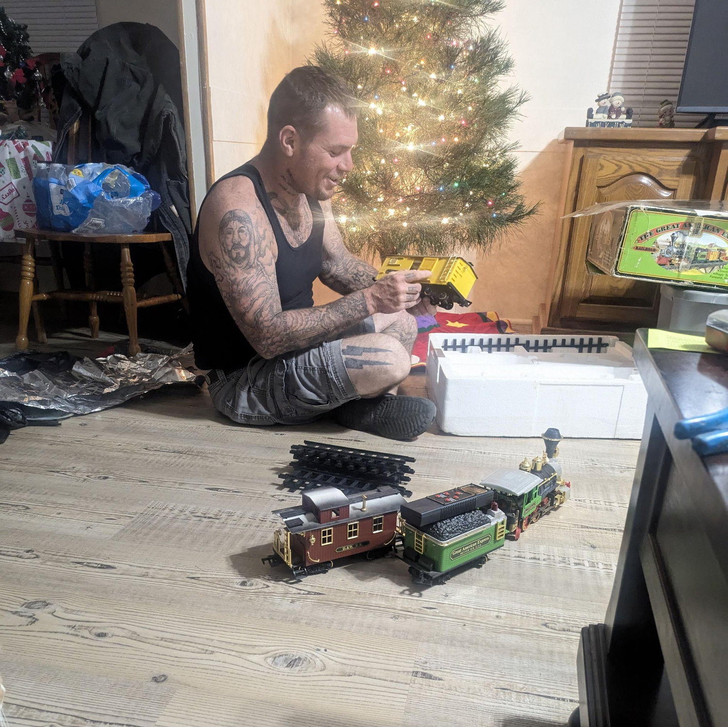 He proposed on Christmas Eve by putting ring on train set.