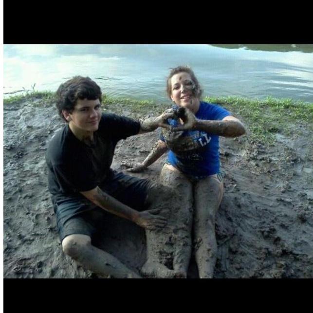 Johnathan(15) and Brianna(14) playing in the mud, after fishing.