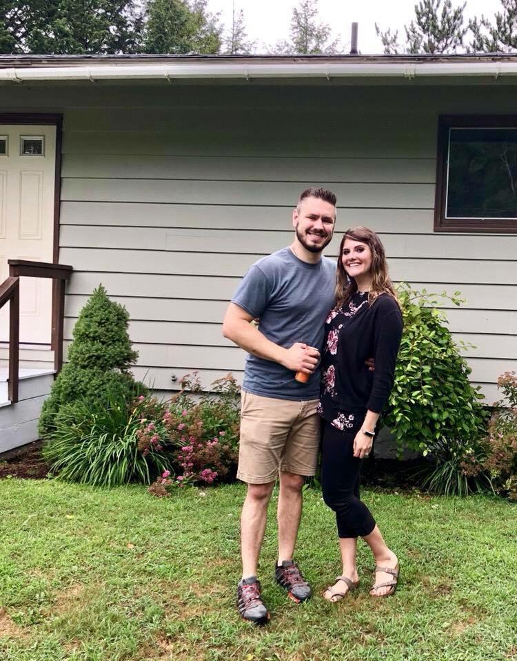 Paul and I in front of our first home in 2018.