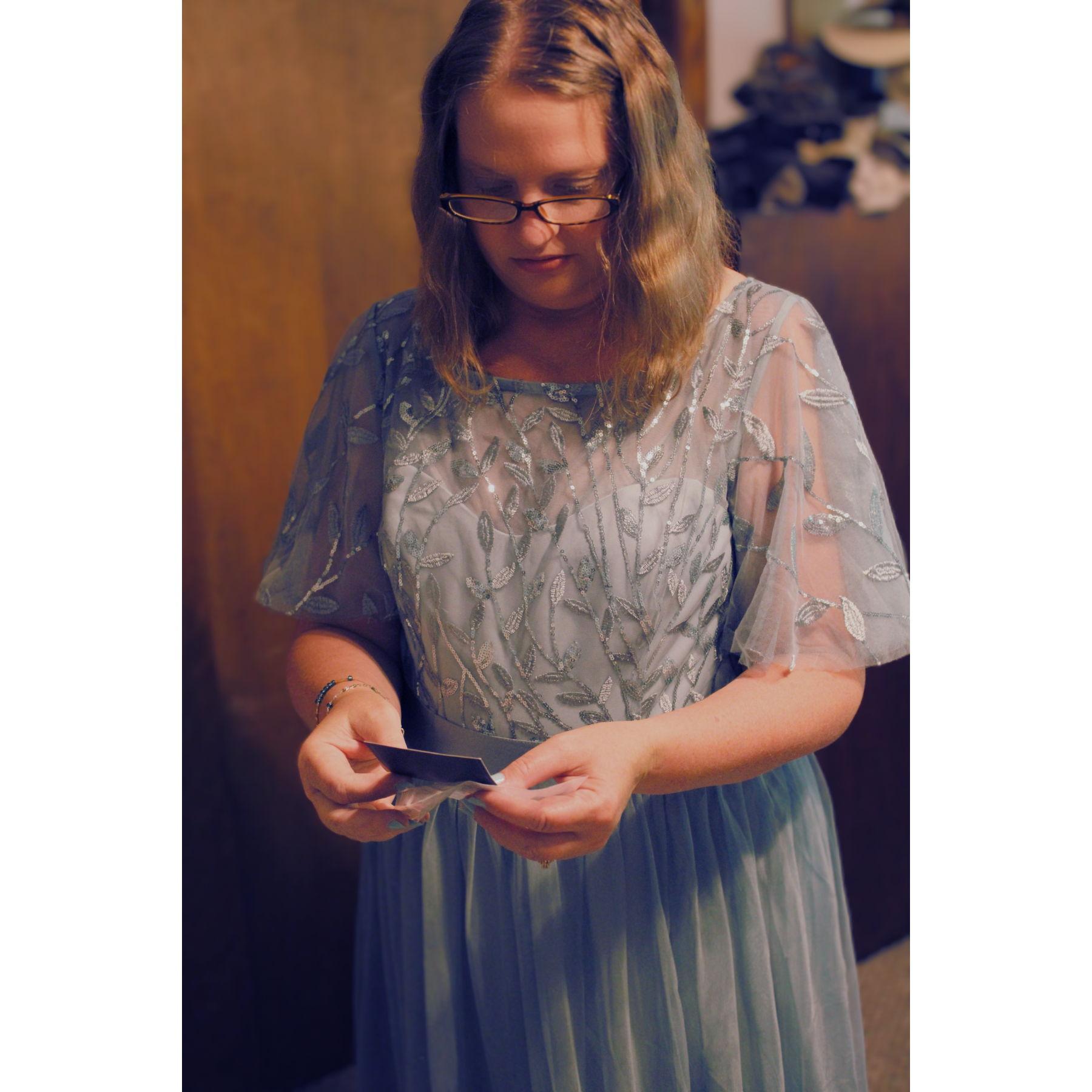 Jennifer reading her gift