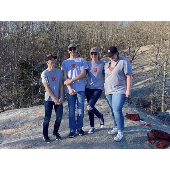 Melody made Dakota and their friends matching t-shirts.