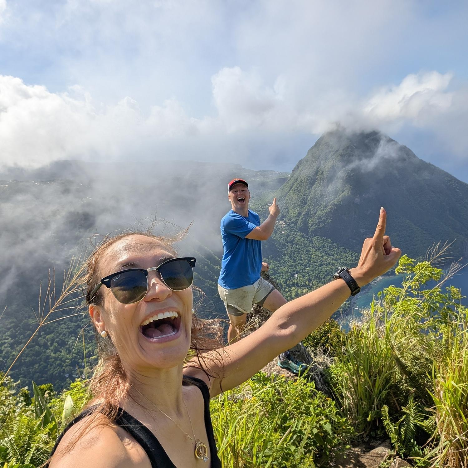 At the top of the Petit Piton climb pointing to the mountain we got engaged on!