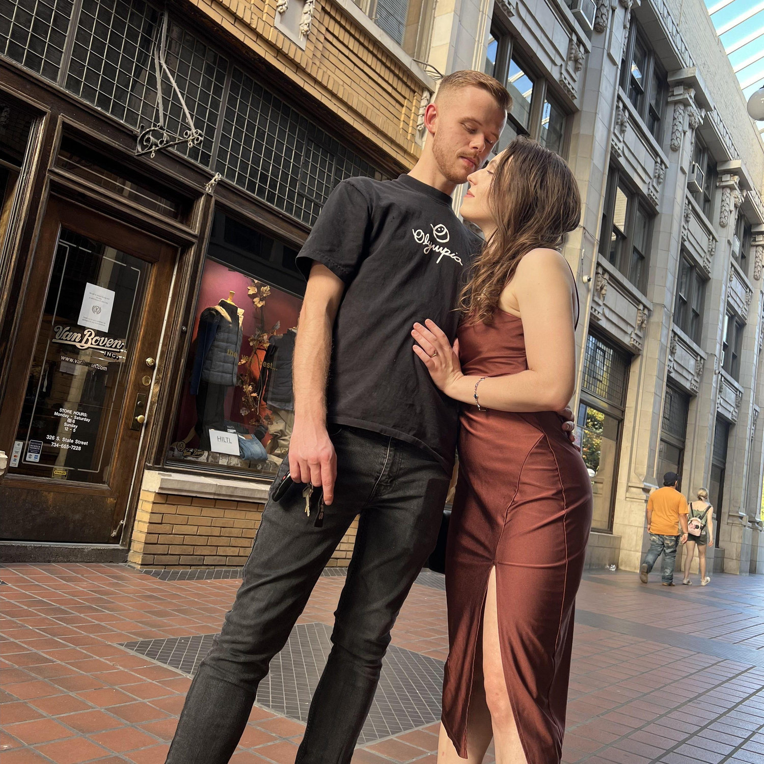 Enjoying our romantic engagement shoot in a favorite spot, Downtown Ann Arbor.