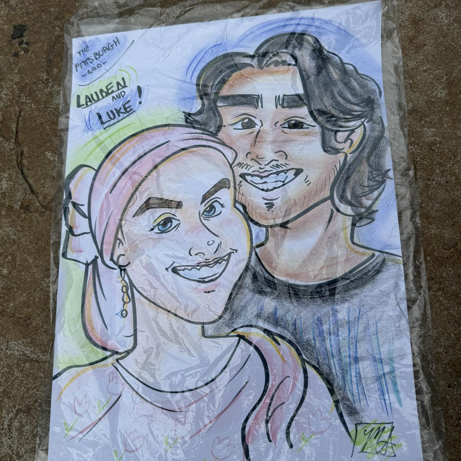 We got a caricature drawn of us at the Pittsburgh Zoo!