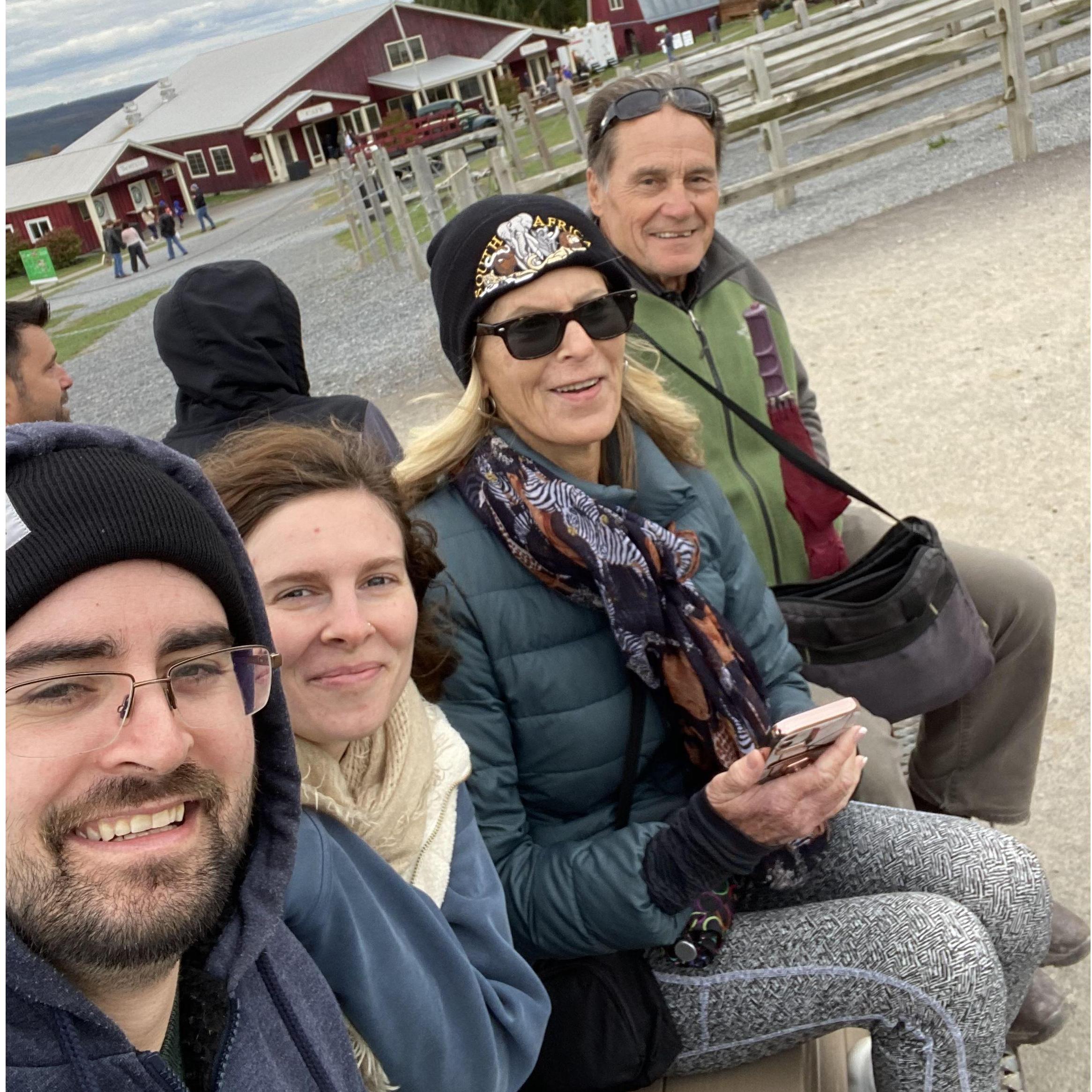 Austin, Marie, Susie, and Phil on their way to pick apples at 1911.