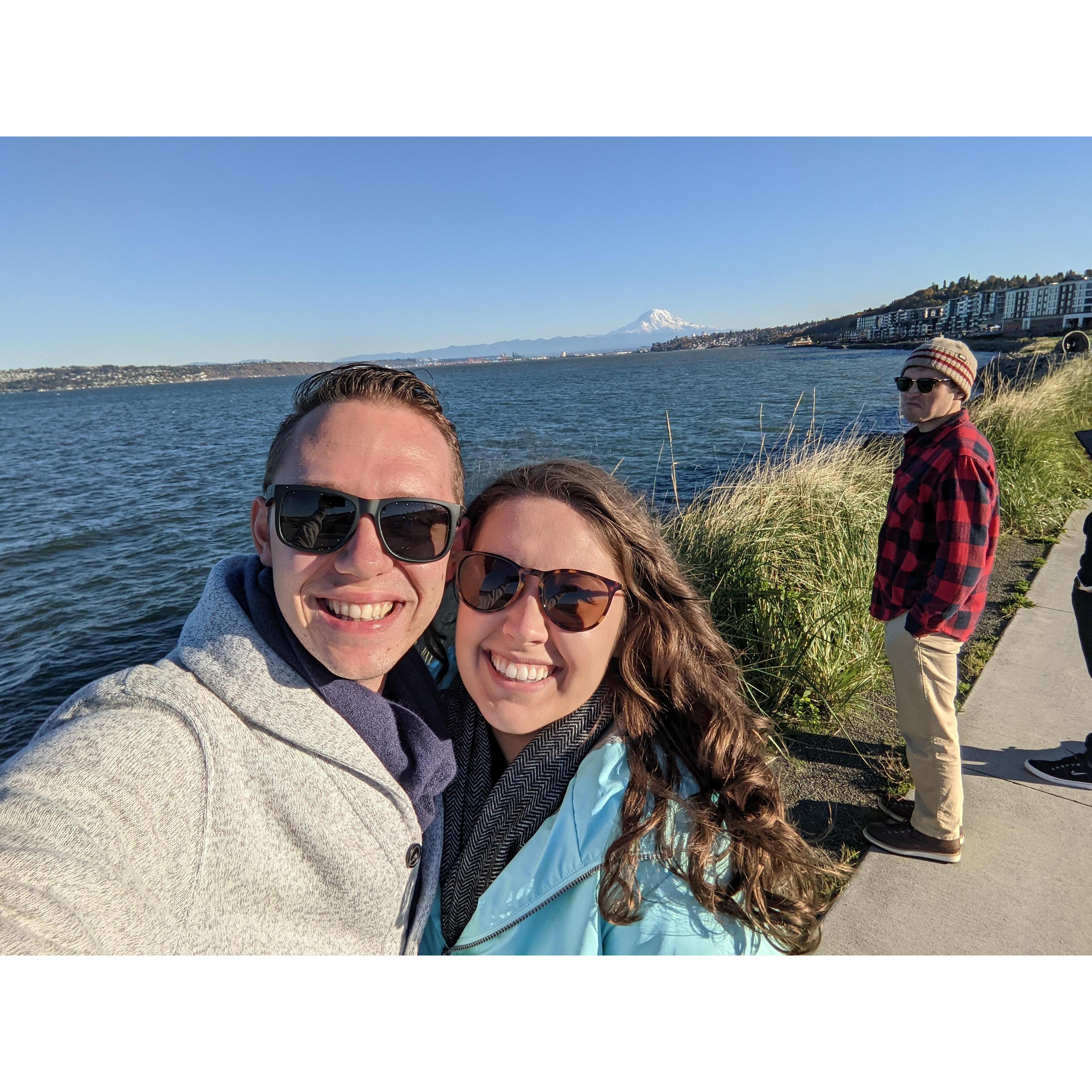 A sunny day in Tacoma with Mount Rainier and a disgruntled pedestrian (aka Connor) in the background.