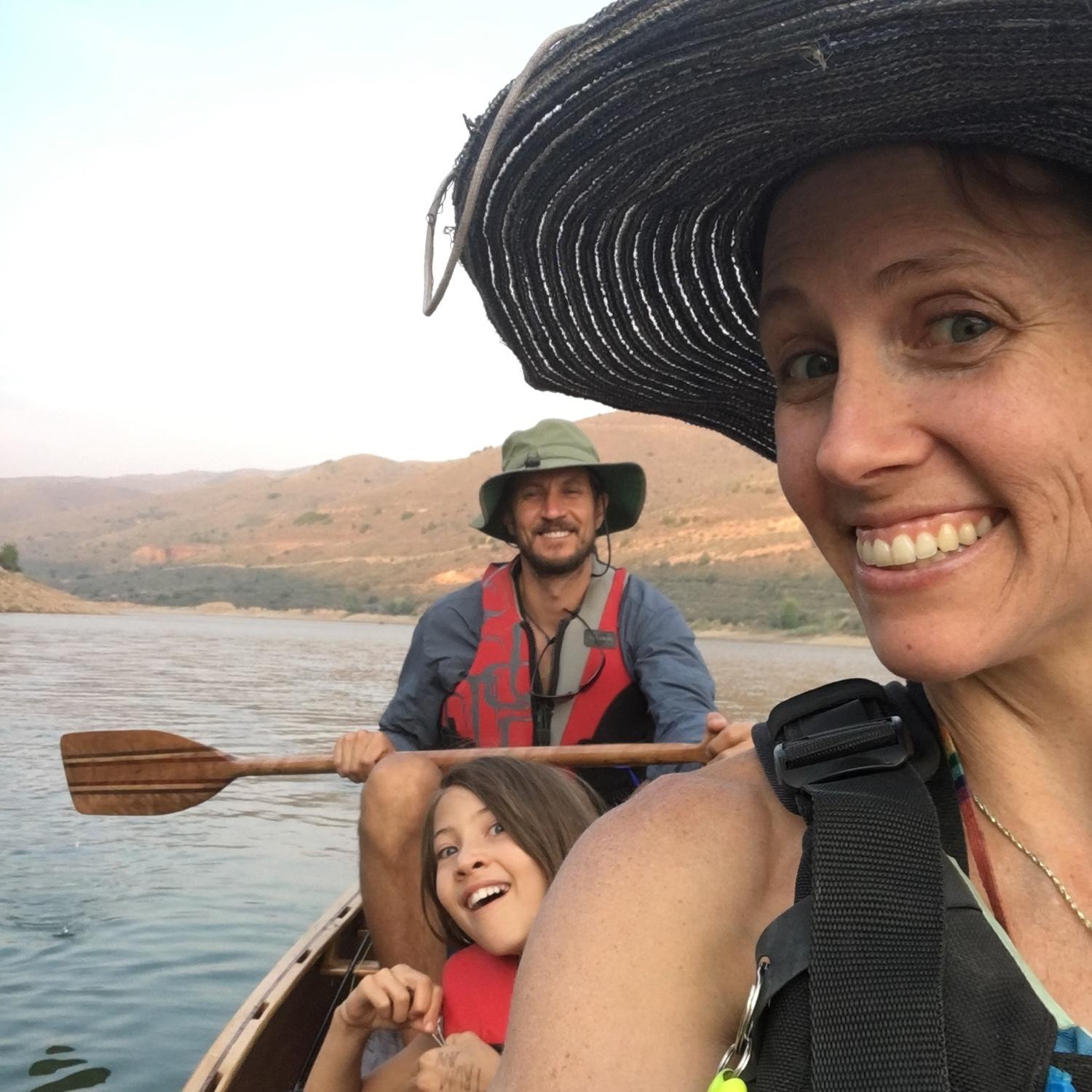 Out on a canoe that Charlie built! Charlie, Maggie, and little Angela!