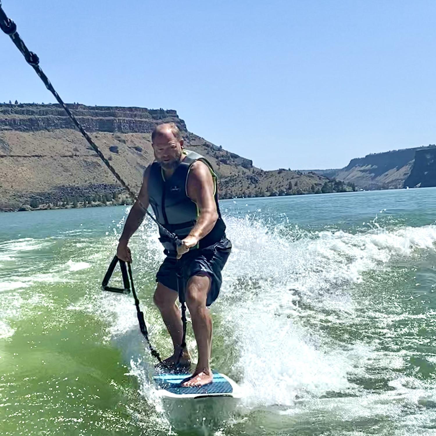 Wake surfing on Lake Billy Chinook. July 2023
