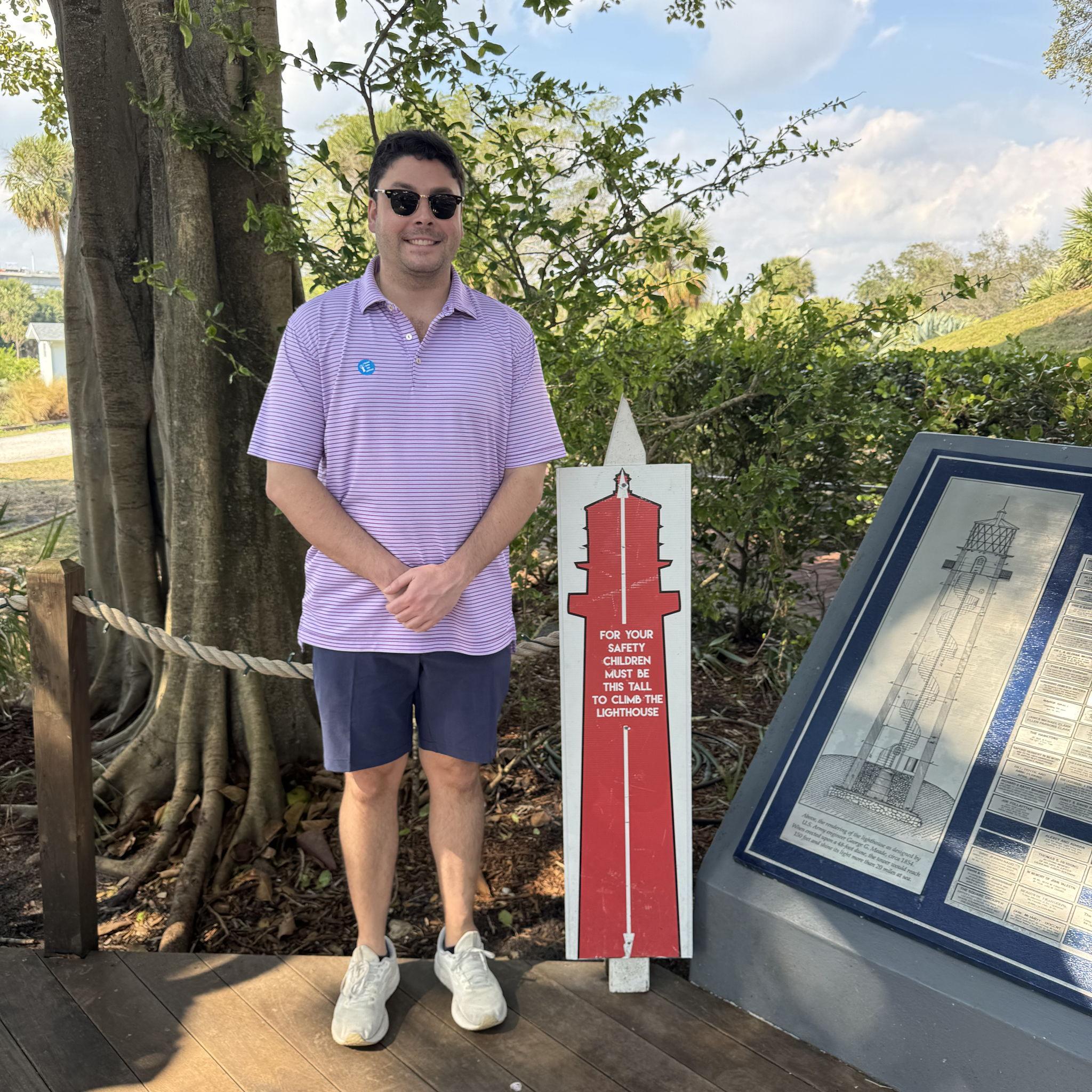 Jeffrey making sure he's tall enough to climb the Jupiter lighthouse.