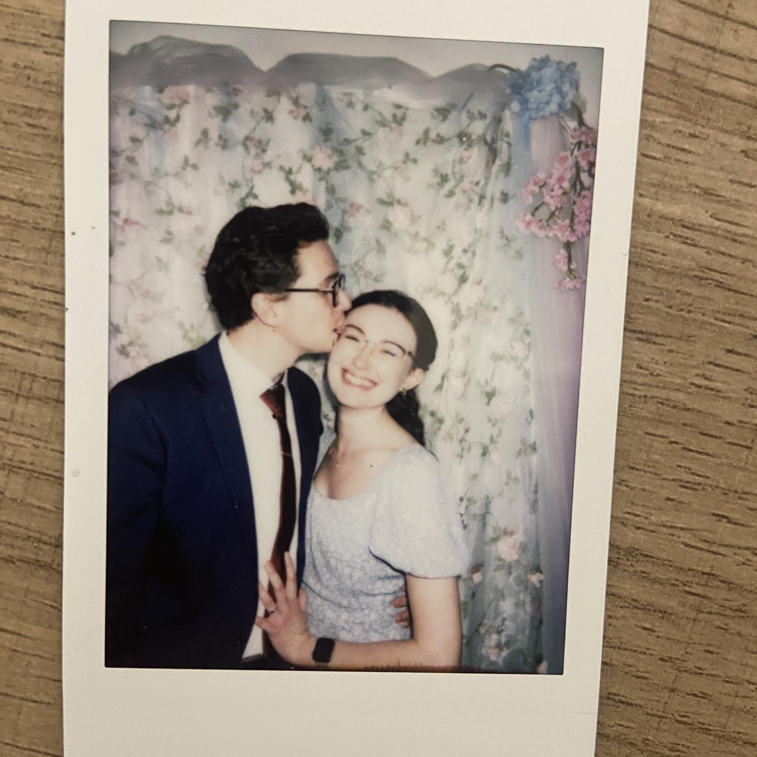 04/12/2025 - Also one of Ana's favorite photos. Michael surprised her with a kiss while taking a polaroid for the photo book at a friend's wedding. Ana insisted on keeping this picture, now displayed on the back of her phone case. Her 3rd grade students call this the "kissy photo."