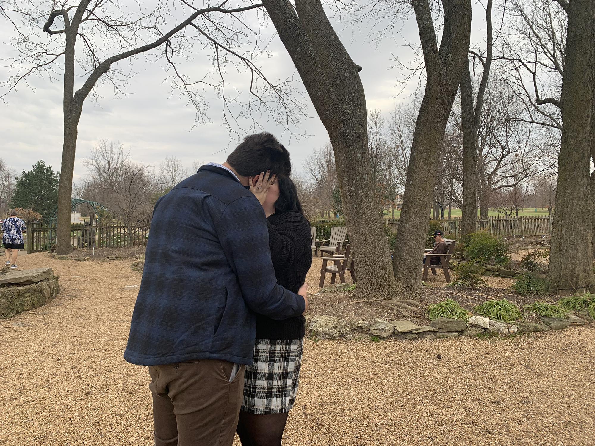 We snuck a kiss (we thought) away from our family after the proposal, luckily someone caught this special moment!