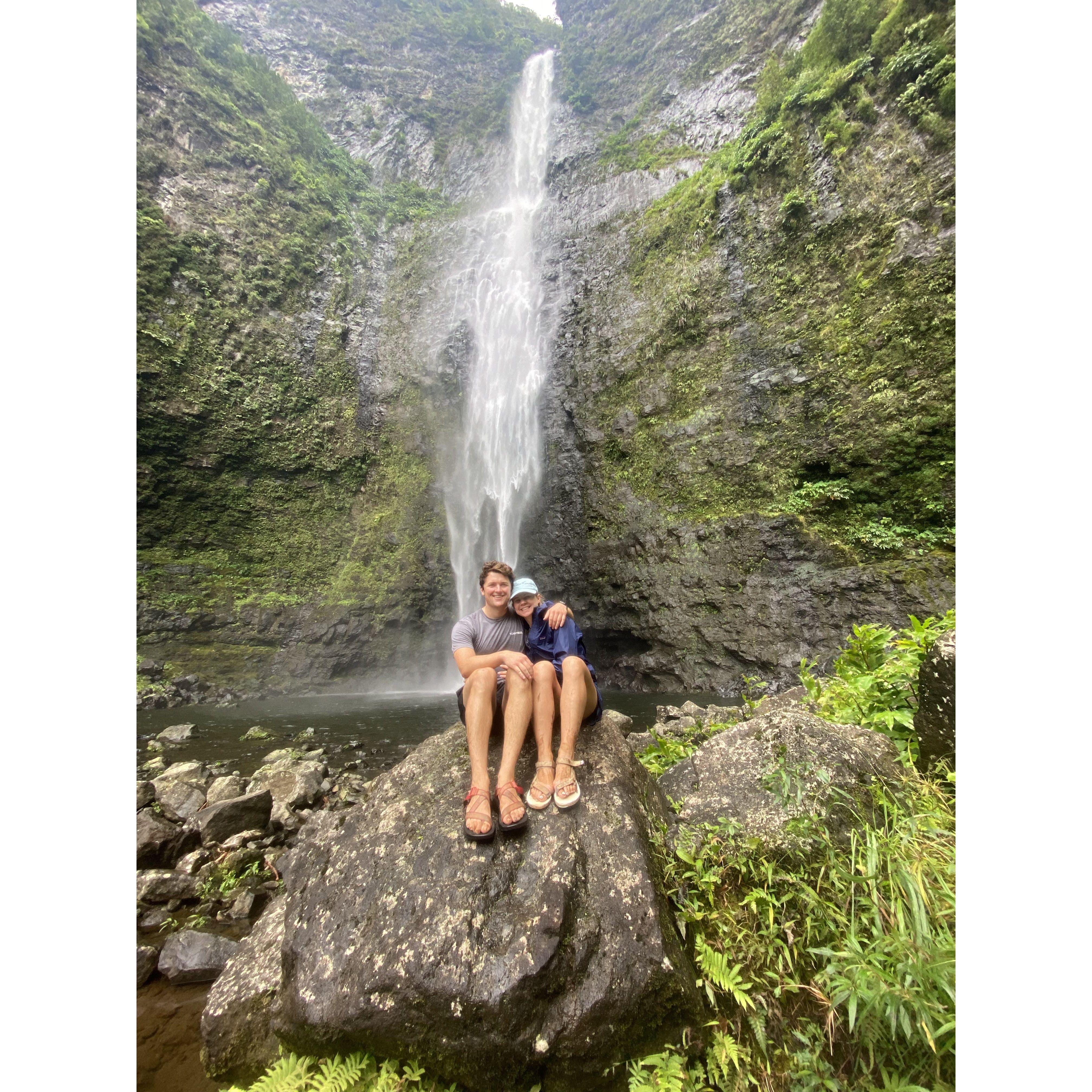 Hiking to a waterfall on the Nā Pali cost in Kauai