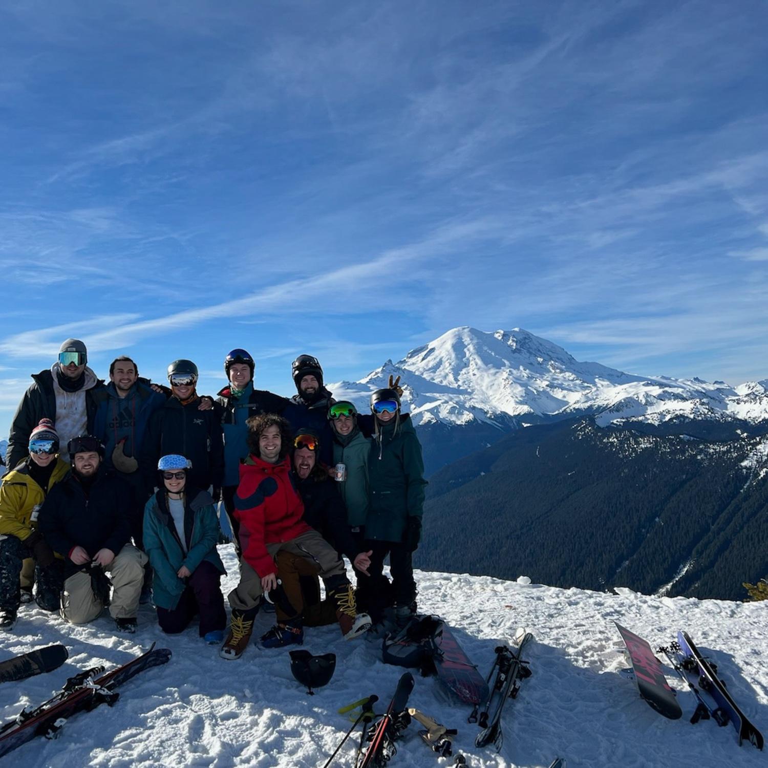 Ski friends posing in front of Rainier