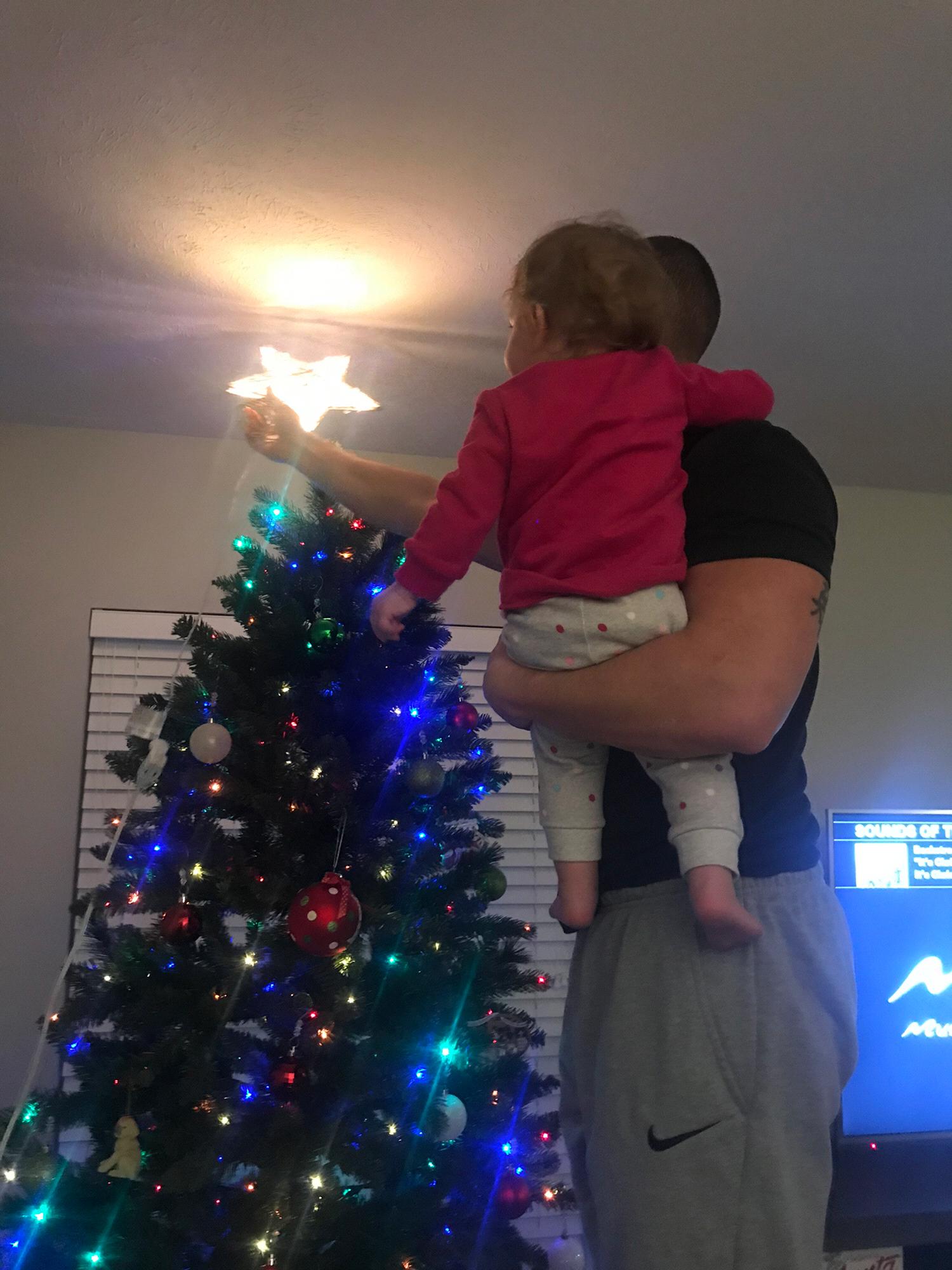 Ben helping Leila put up our first Christmas tree together!