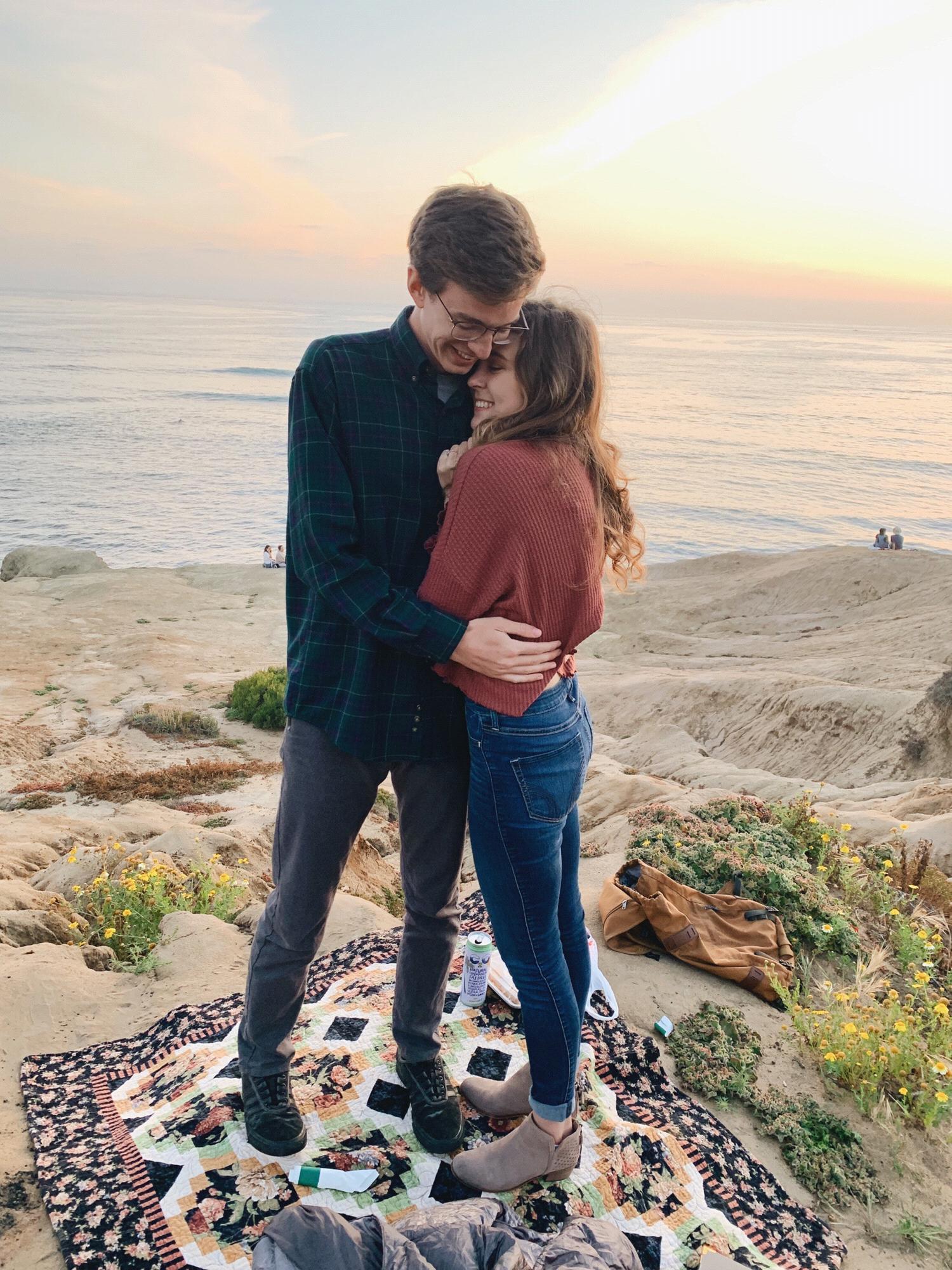 he asked her to marry him on sunset cliffs as the sun set on their last night of college.