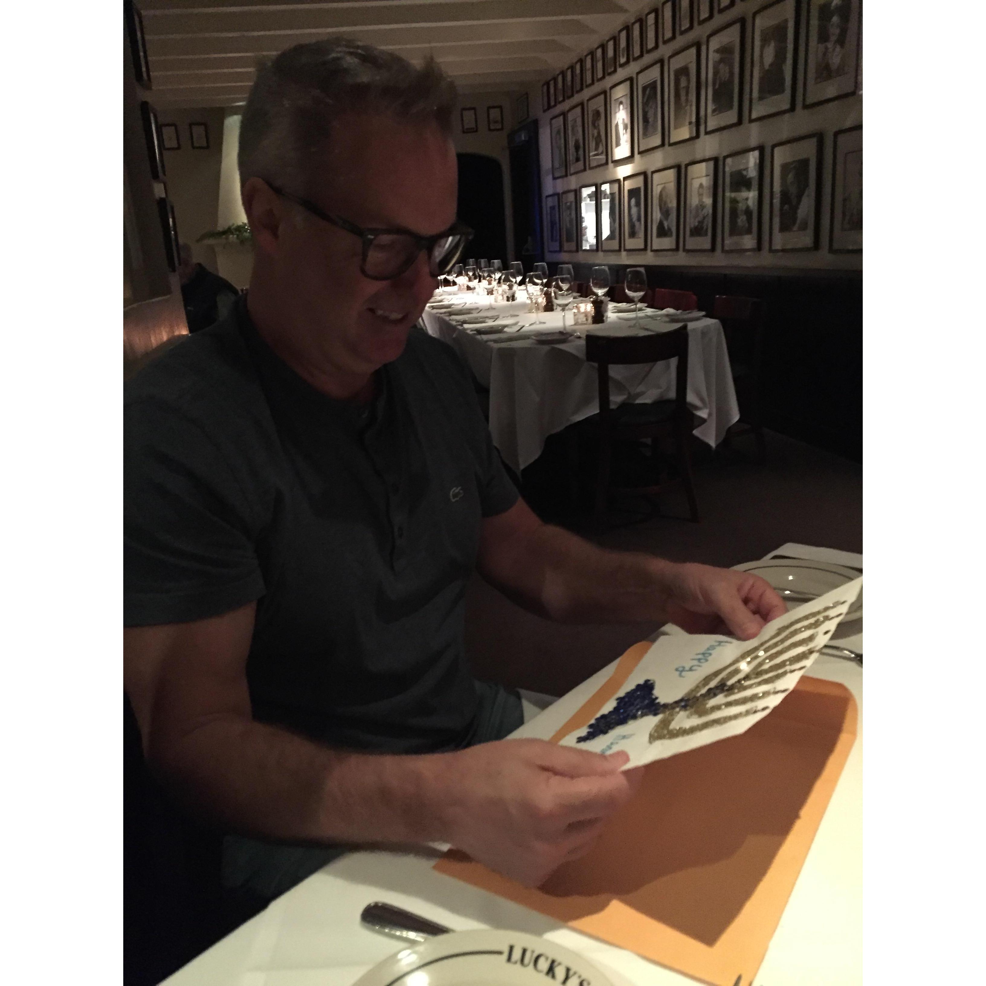 Our first holiday together! Joey reading the Hanukkah card Kiera made him.