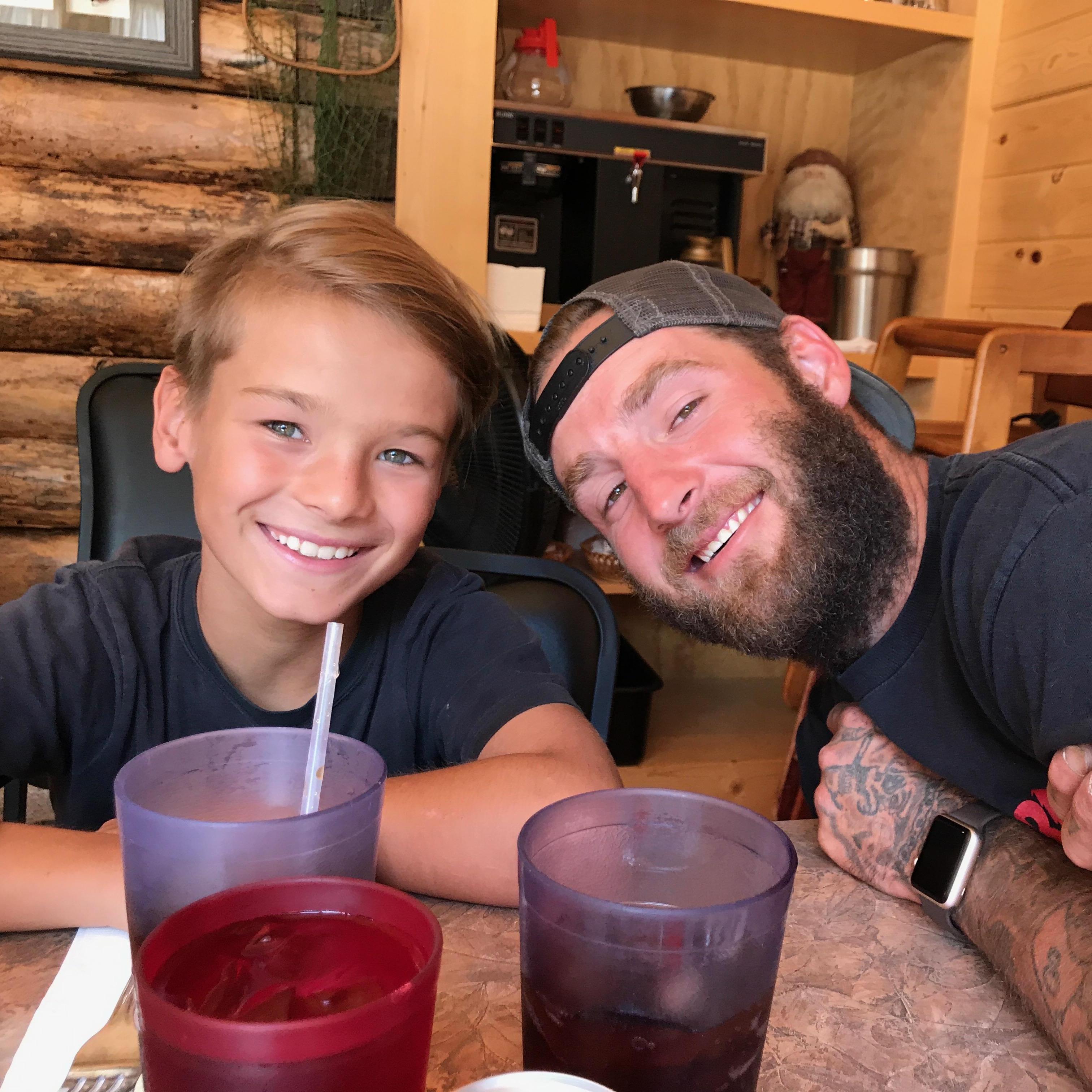 Joey and his son Jaden enjoying a wonderful breakfast next to the Madison River just outside of Ennis, Montana.