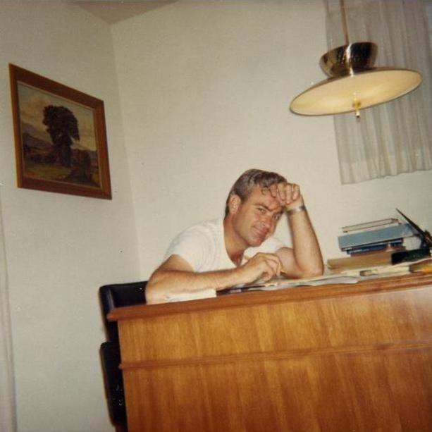 Bruce is up at Elbert's desk..