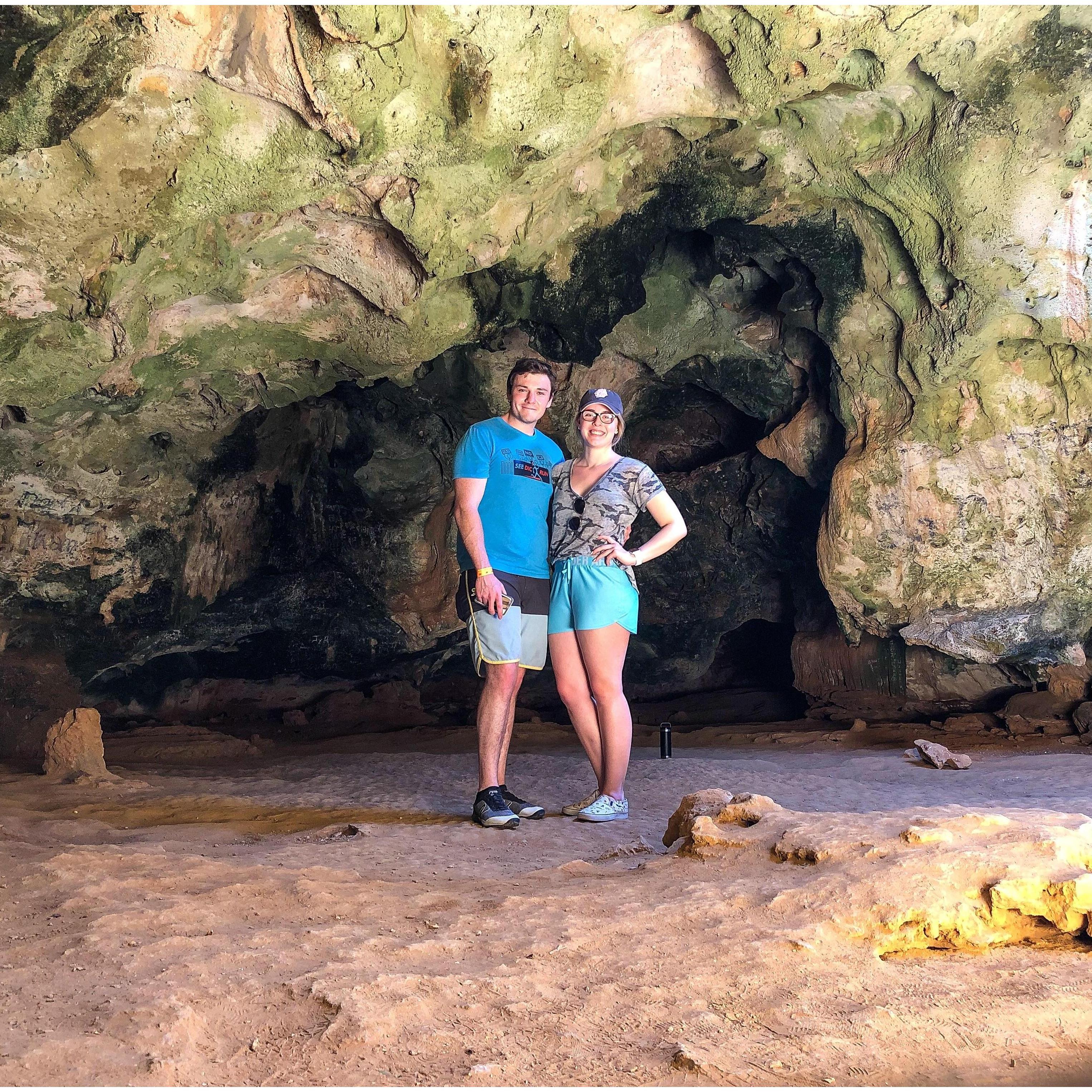 Exploring a cave on vacation in Aruba.