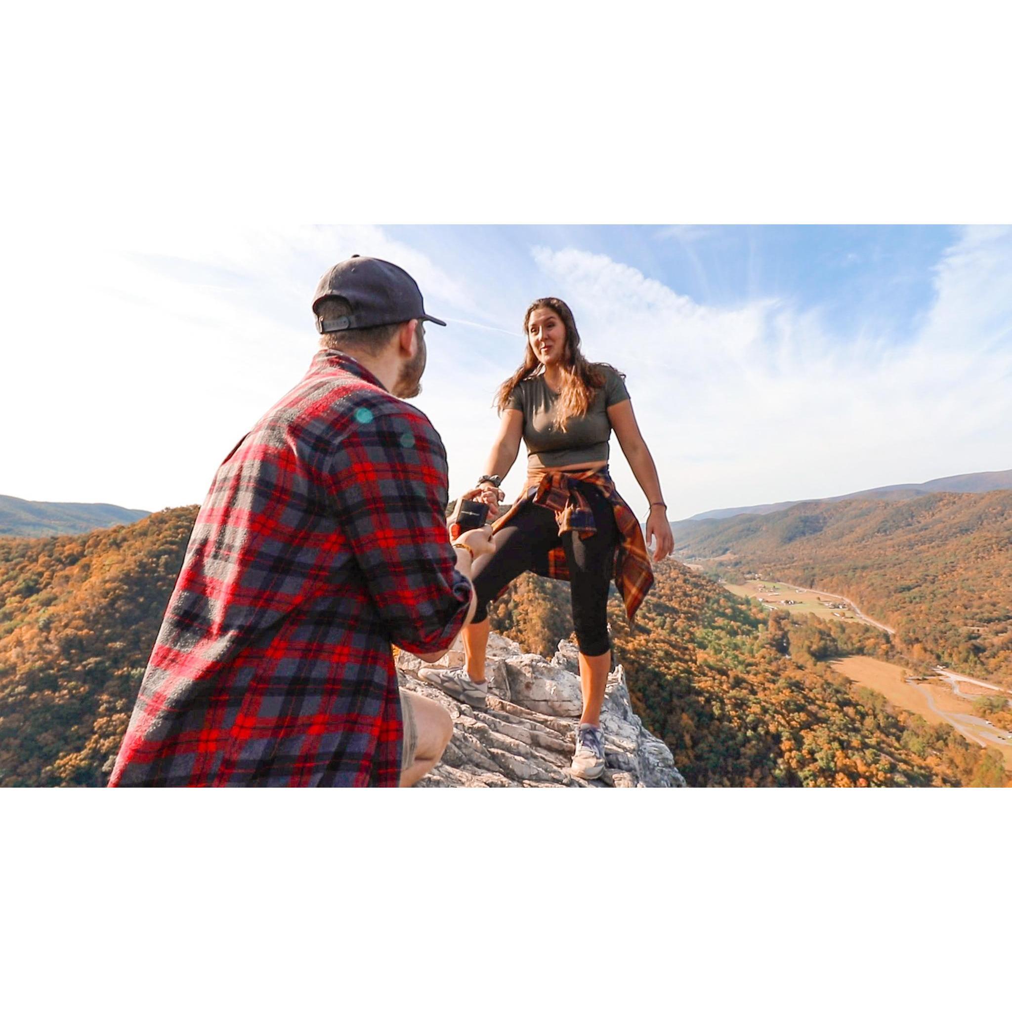 Jacob proposed on the tippy top of Seneca Rock. These photos might make you nervous, with only about a 6 foot wide landing and 1000 foot cliffs on either side, but only these two could pull it off!