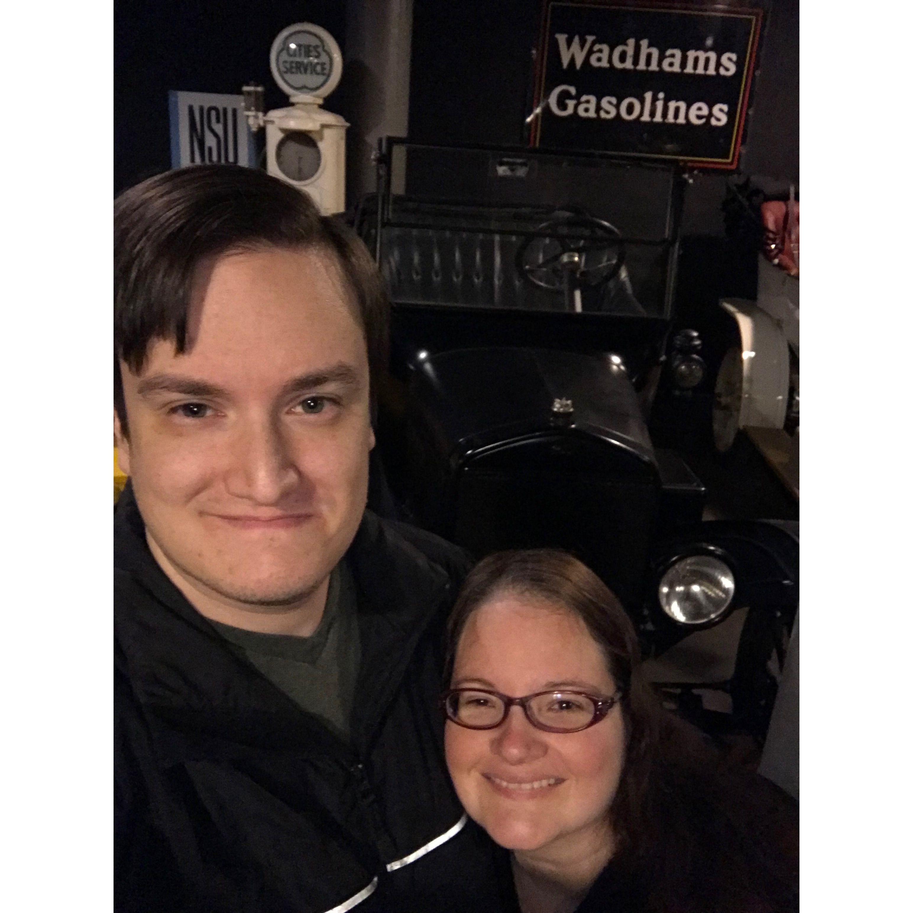 Selfie in front of a sign that says Wadham’s Gasoline at WI Automotive Museum.