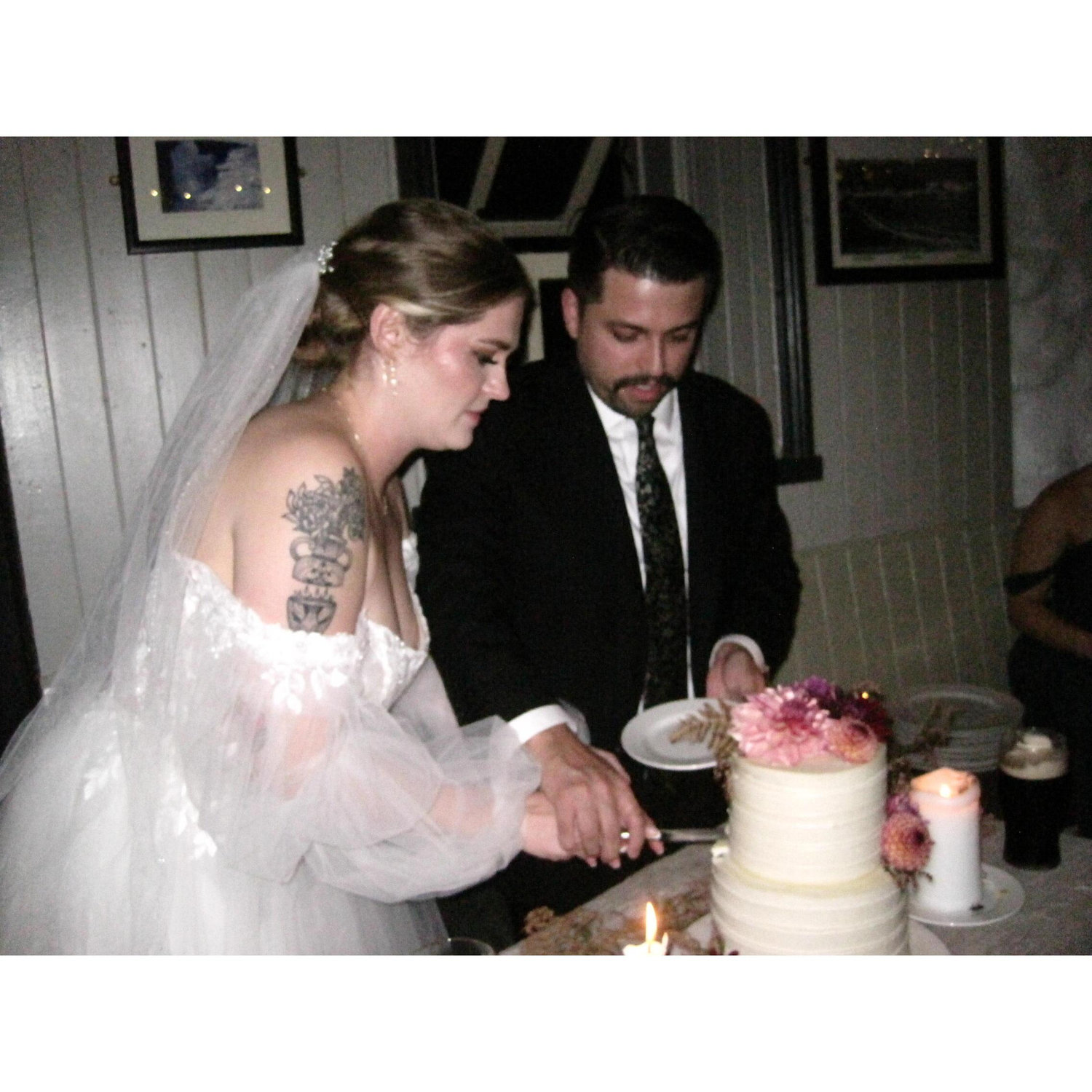 Cutting our cake! We had two flavors - bottom layer was chocolate with Biscoff cookie filling and the top was carrot cake with vanilla buttercream filling