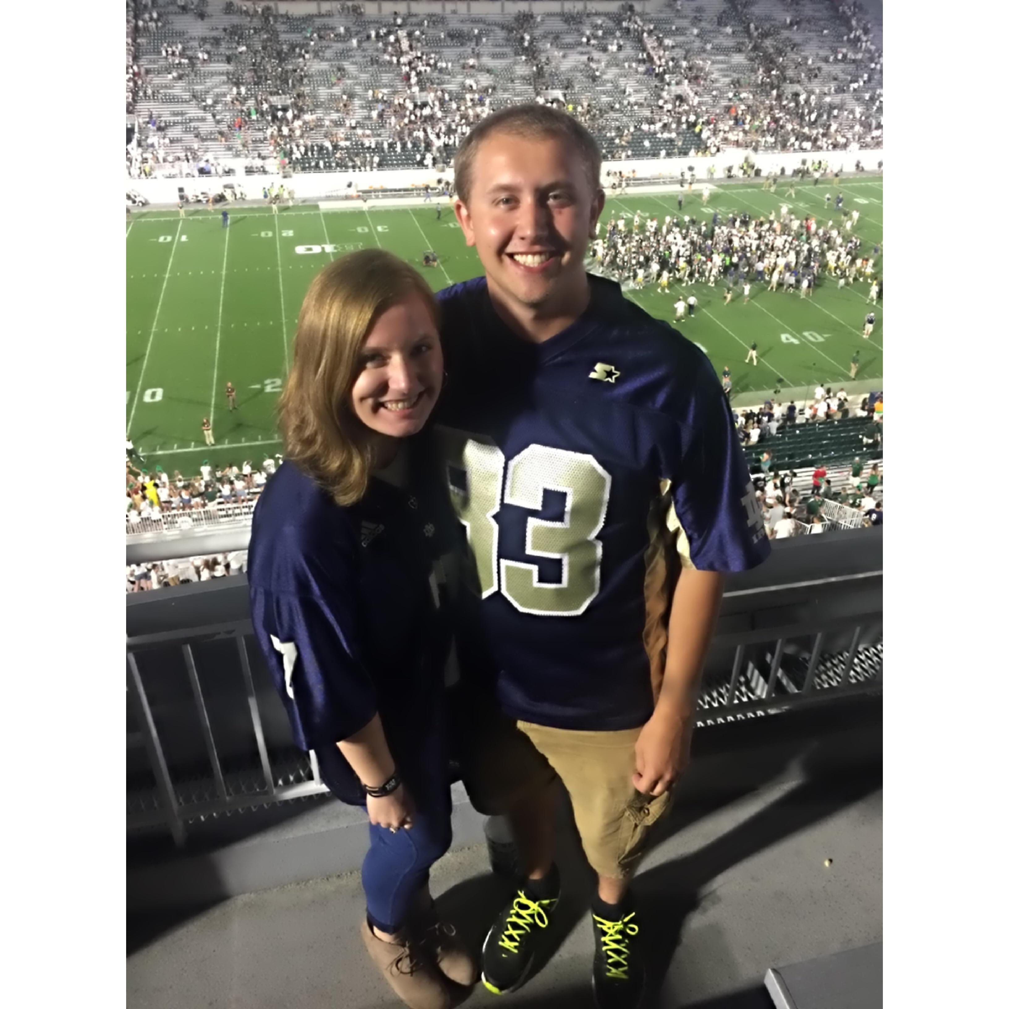 The couple's first Notre Dame game together at Michigan State.