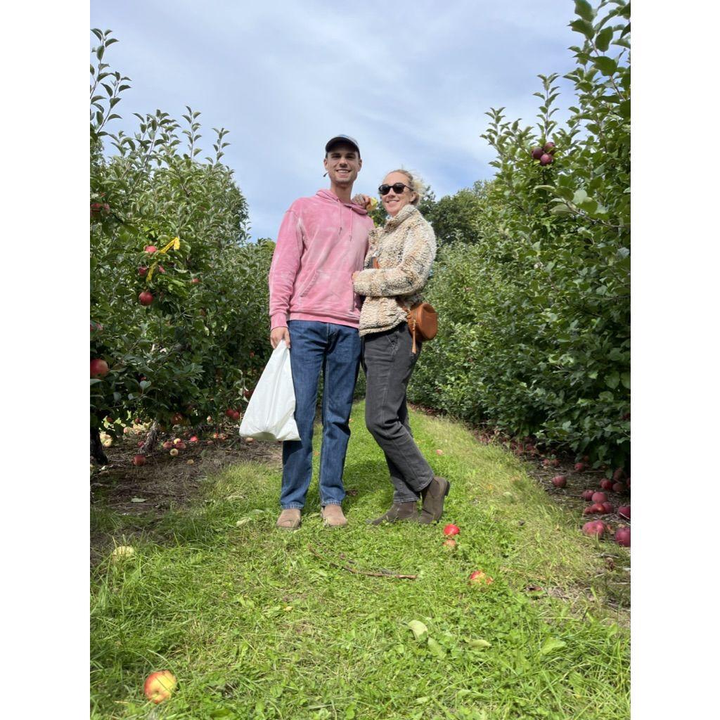 MacKenzie loves a fall apple picking adventure, Roman tolerates it lovingly