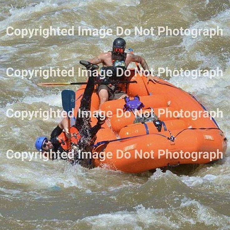 Never paid for the copyright images, but we did pay for thinking that white water rafting at the height of the season would go without a hitch...can you spot Alaina underwater?