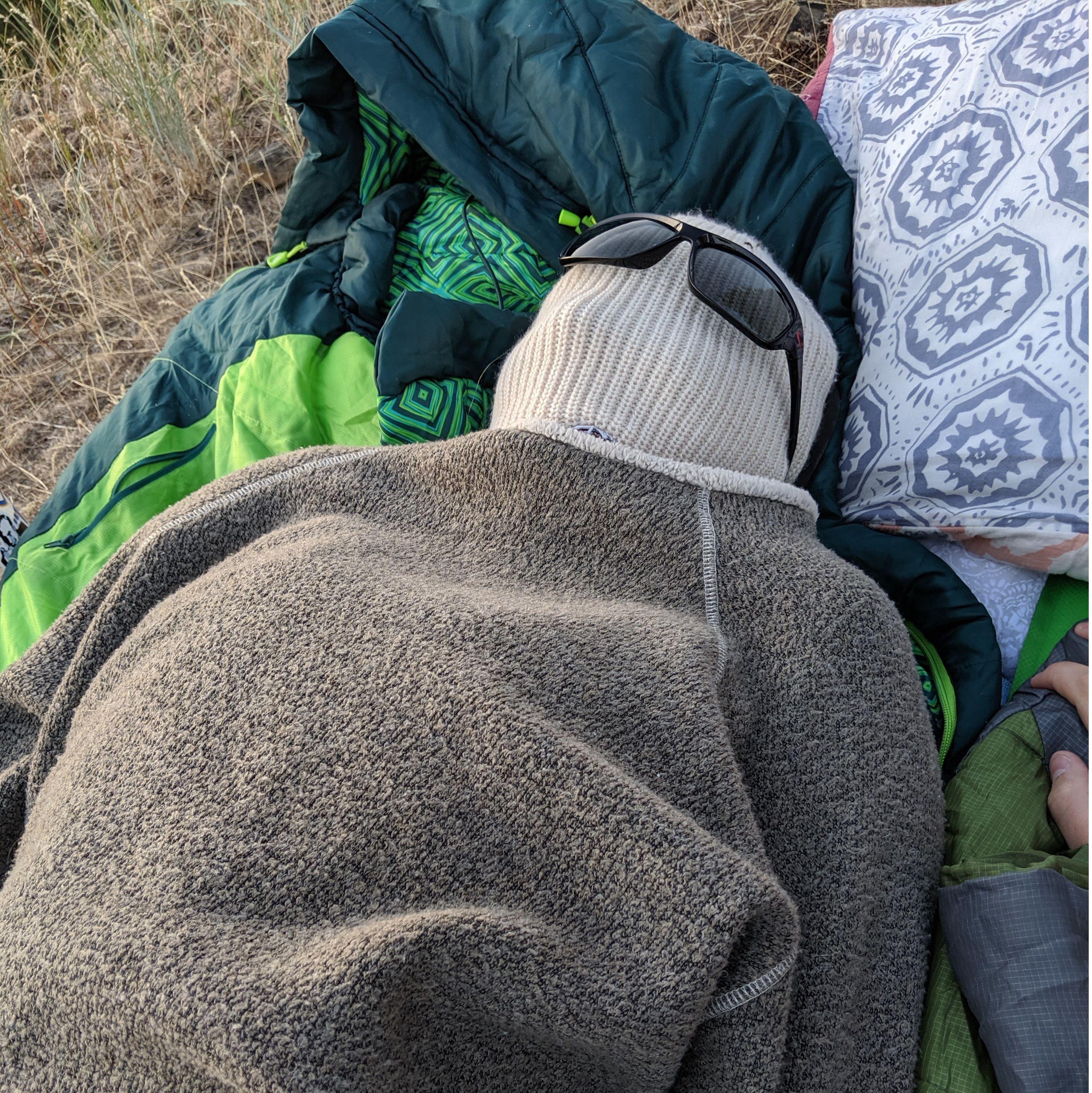 Mara hiding from bee's the first time we went camping together- Summer of 2019