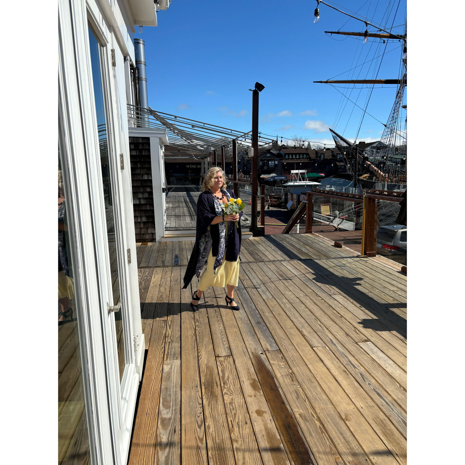 Heidi, Dash's matron of honor, walks down "the aisle" above Newport Harbor