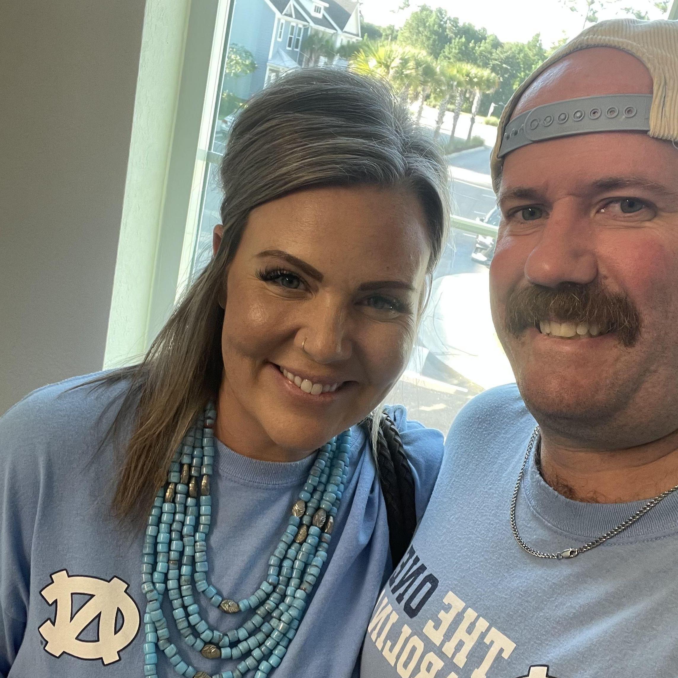 Kate finally in Carolina blue. During their first year dating, UNC beat Duke in Coach K's last game. It was all Brian needed to happen to know he'd met his future wife.