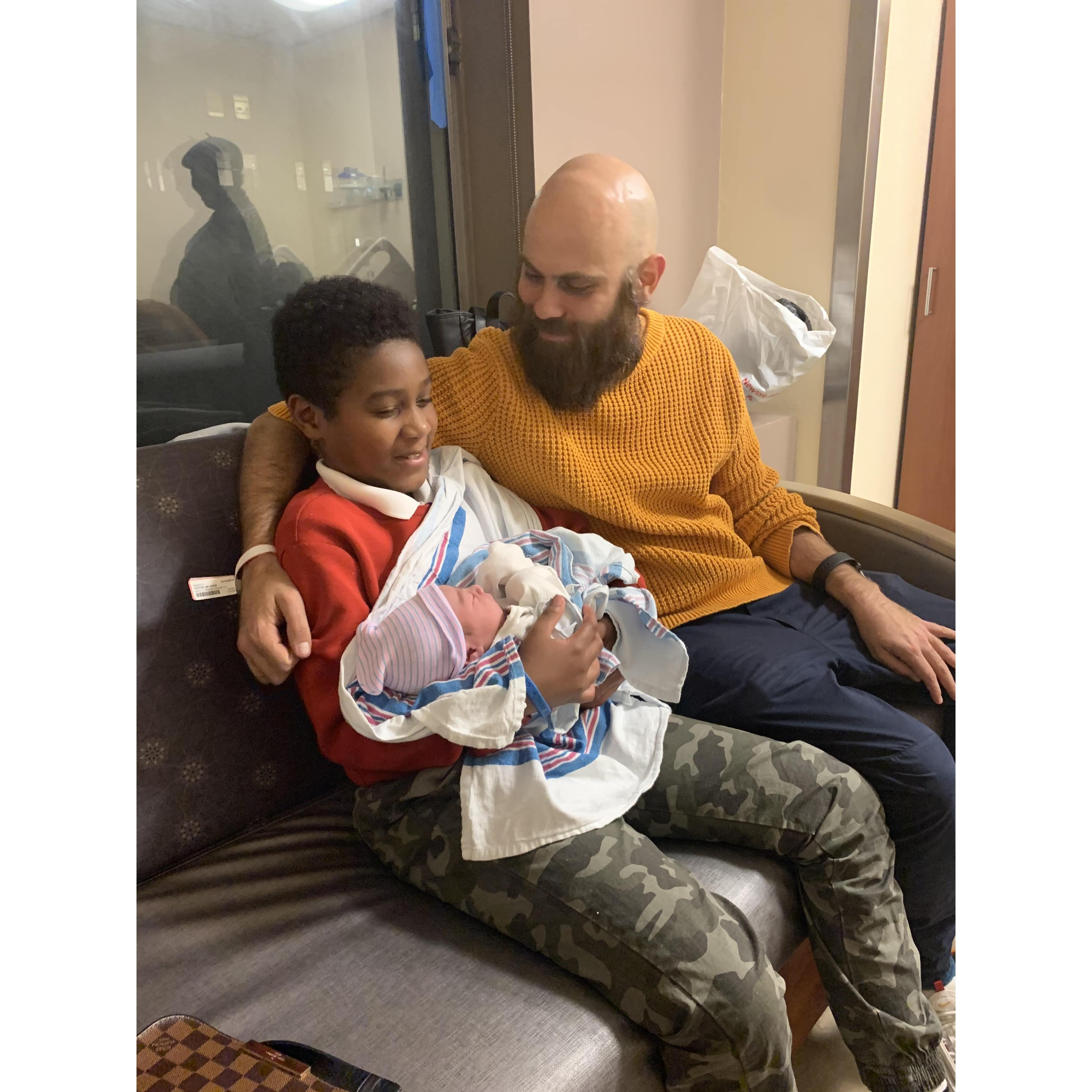 Aiden holding Asante for the first time.