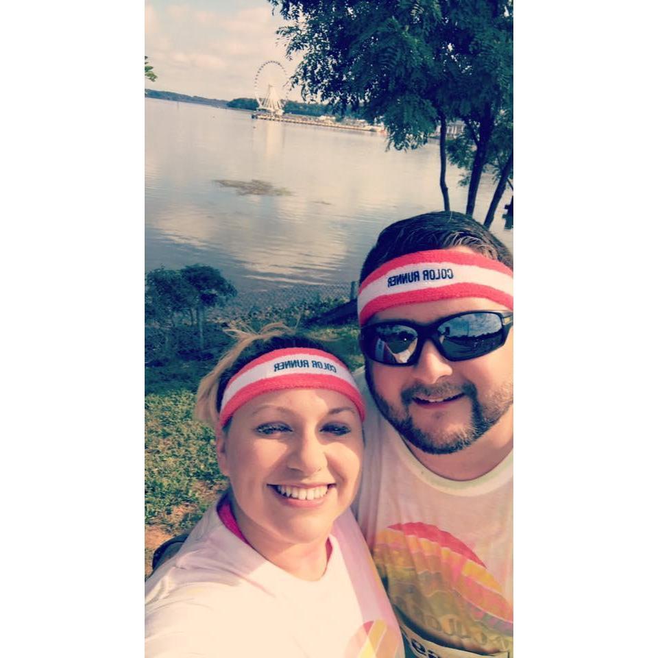 Taking a picture by the water at the color run