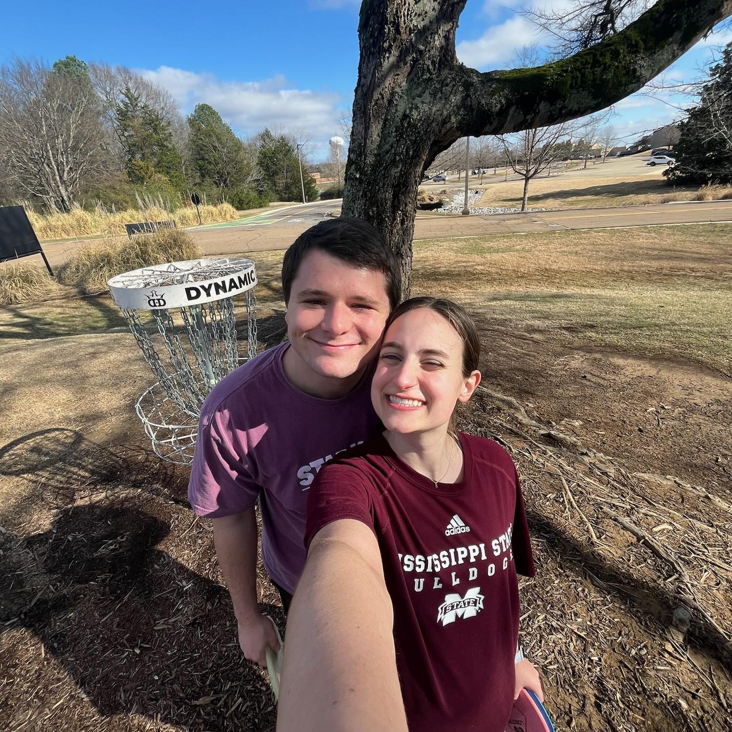 Logan attempting to teach Emily how to play disc golf! Outdoors activities have been a staple of our relationship.