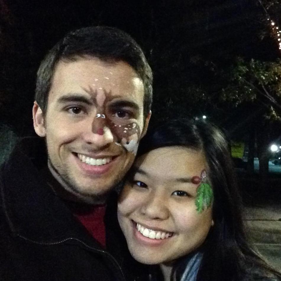 The couple celebrating at the "Holiday Sing-Along and Downtown Stroll" during the Christmas holiday