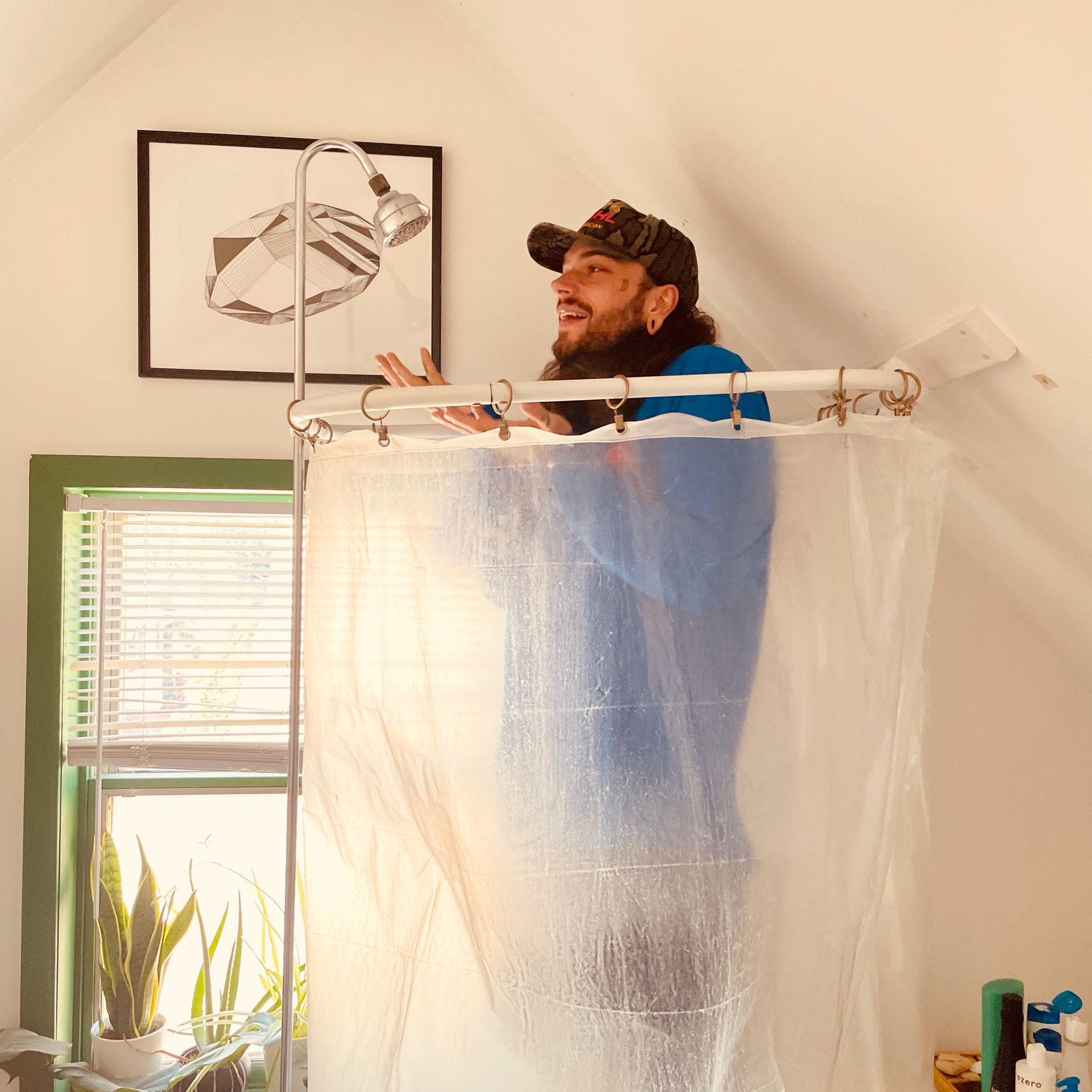 Sawyer in the shower in their first apartment