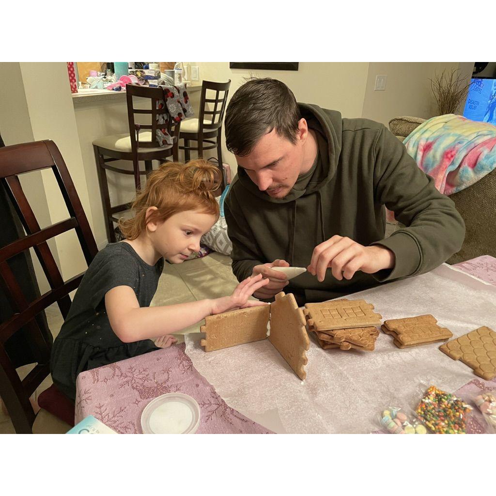 Ricky's niece Khloe showing him how to make a gingerbread house