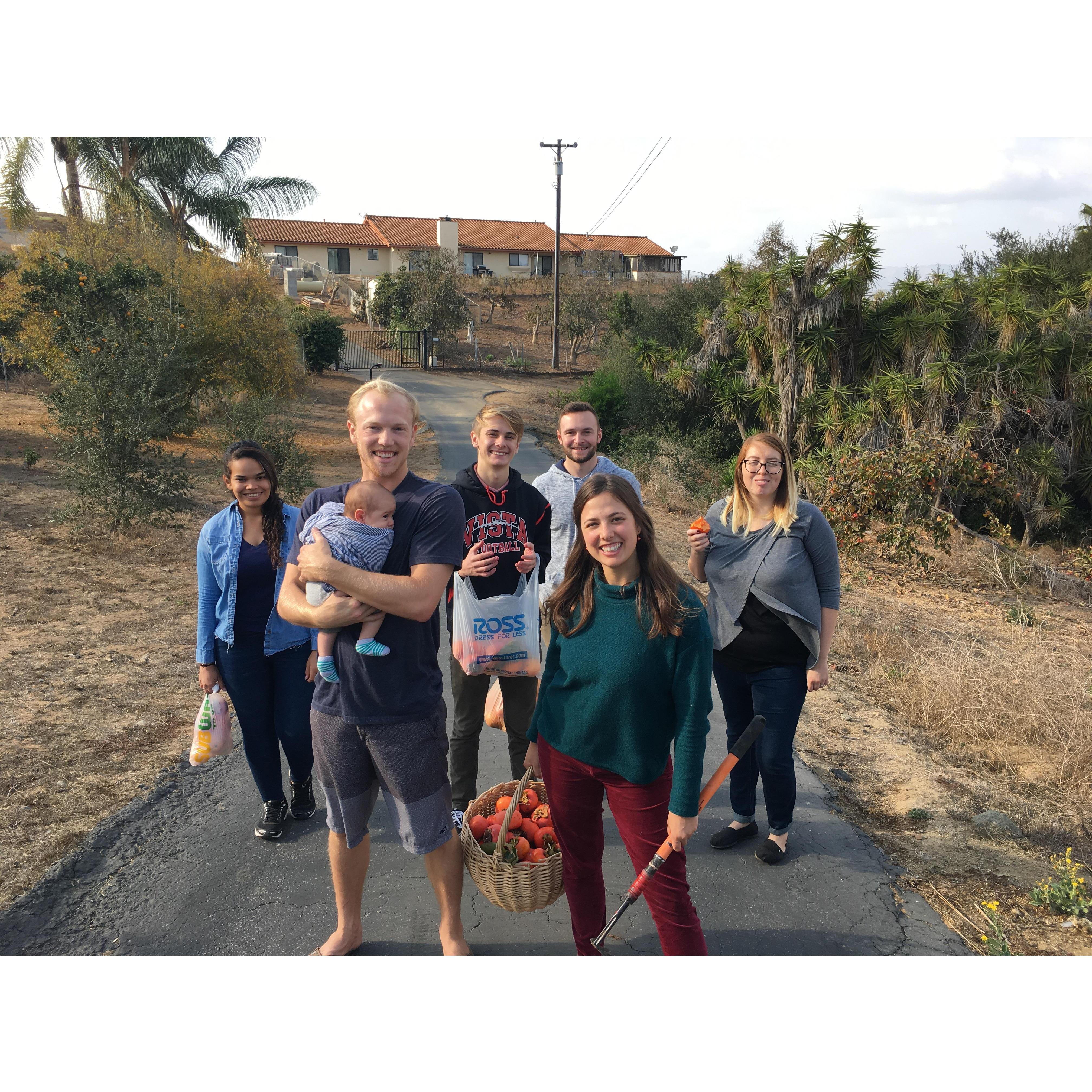 This picture makes me laugh.  Andrew's holding Judah, Alyssa's baby, and we had just finished picking persimmons with a group of our friends after a Bible study. It just cracks me up!