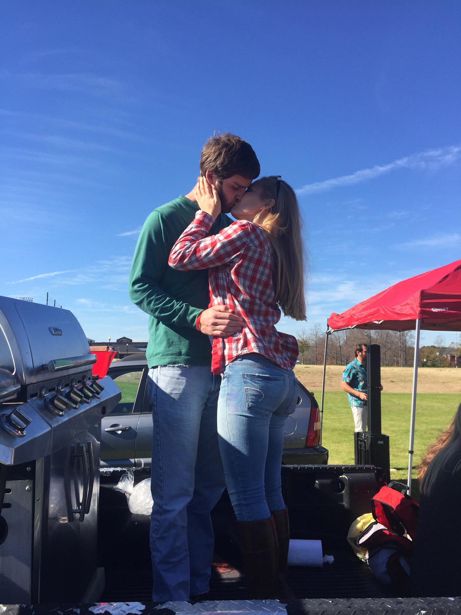 The iconic tailgate kiss photo. Maggie lost a dare, but I benefited. - Will