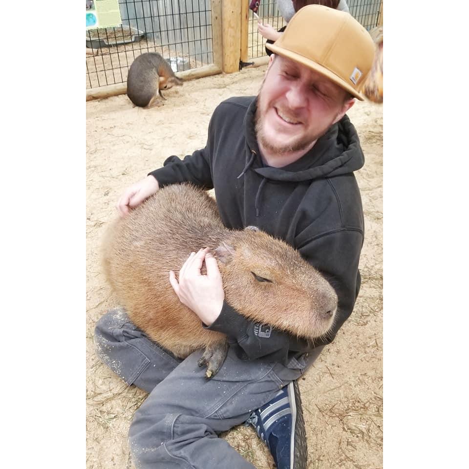 Jake so happy to hold a Capybara for the first time (his favorite animal)