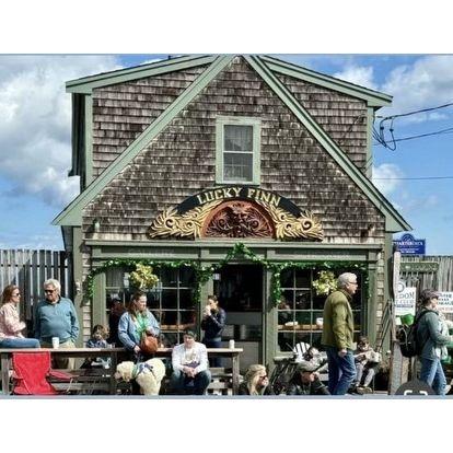 A stangers photo of us sitting outside of our favorite coffee shop on the day Brendan proposed!